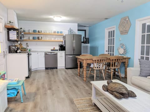 Open concept living space keeps the kitchen, dining and living room areas open