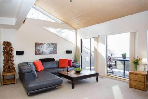 Bright, open, warm living room with an amazing view of Park City's Round Valley