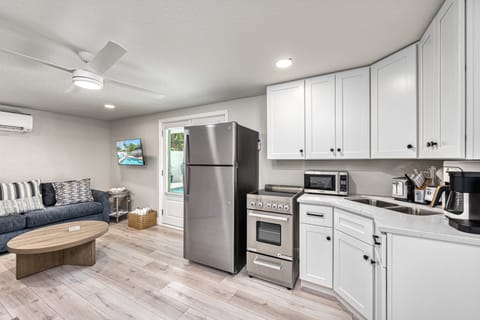 A full sweep of the living area shows everything in one bright space.