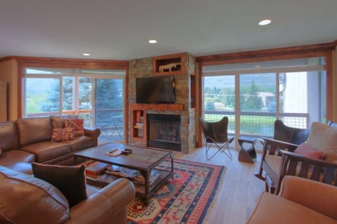 Main Level Living area. Gas Fireplace, TV.
Covered Deck with grill