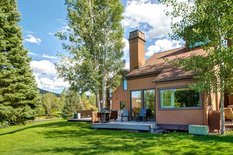 Side Patio with Outdoor Dining and Private Back Patio with Rocking Chairs and BBQ