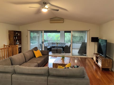 Relax in the comfort of upstairs living room or step outside to undercover area
