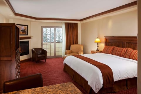 Settle in by the glowing fireplace after mountain adventures.