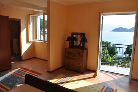 Bedroom 2 with balcony, full bath, and queen bed