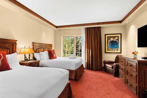 Wake up refreshed in bright beds with warm lodge style.