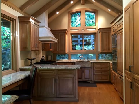Kitchen looks out to fern wall garden and East patio.