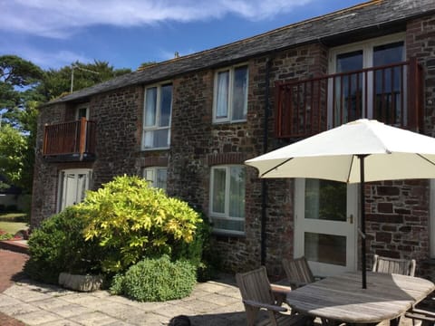 Barn conversion with west facing patio.
Coach on left, Stable on right
