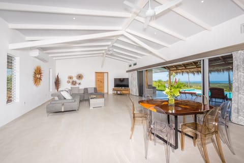 Open setting with patio doors that extends the entire width of living room