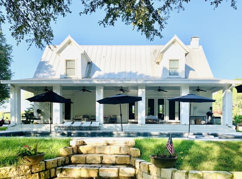 Stately family friendly farmhouse on 10 verdant acres with storybook lake view.