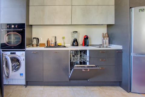 Kitchen equipped with microwave, oven, dishwasher, washing machine, 2 hob stove,