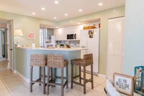 Extra bar seating in the open kitchen with pantry.