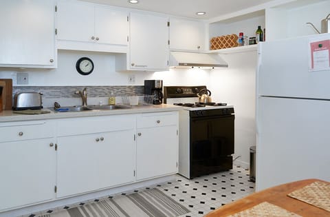 Gas stove, full size fridge, coffeemaker, toaster and more