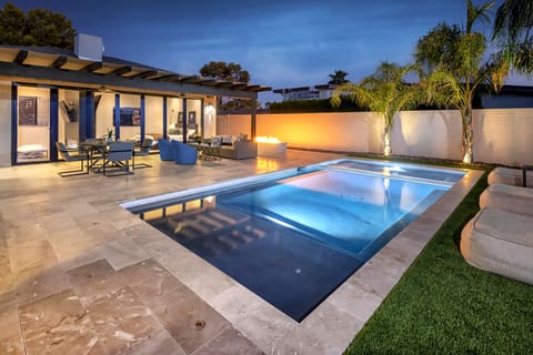 Relax and revive in an entertainers dream backyard. Heated pool and huge hot tub