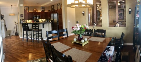 Porch view of Dining room, Kitchen and Den 