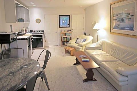 Another view of your separate main room with your kitchenette & dining table.