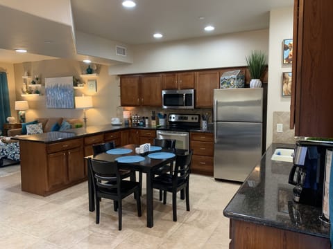 Large kitchen with beautiful granite counter tops and stainless steel appliances
