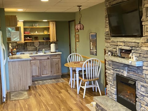 Hot plates, drip coffee, toaster oven, air fryer, and blender stowed in pantry.
