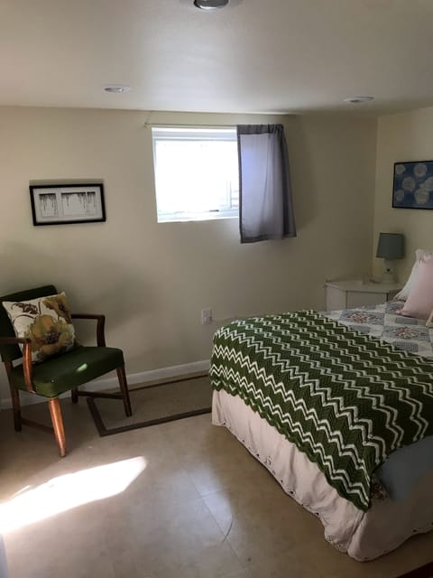 The bedroom with afternoon sun coming in