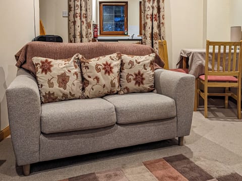 Living space with modest dining area | Little Tigh Craggan - Tigh Craggan Cottages, Weem, near Aberfeldy