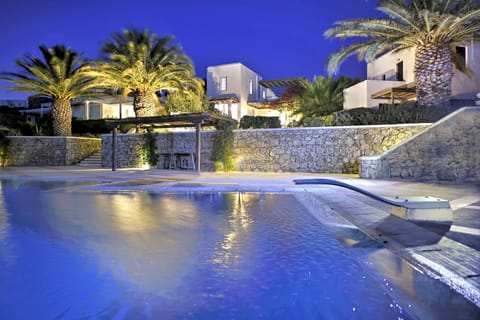 The villa and pool at night