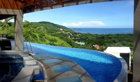 Pool, whirlpool and walkway from driveway to front patio