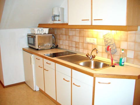 Kitchen in Aberg apartment, with Combi oven / microwave / Grill, 2 ring hob, sink, fridge with small freezer