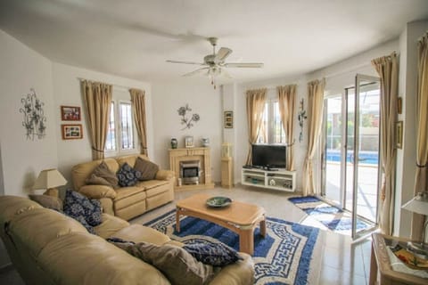 Family Room (Lounge) with double patio doors leading to the terrace and pool.