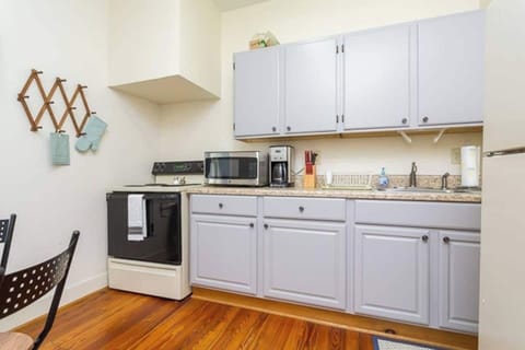 Full size kitchen with refrigerator, stove/oven and microwave