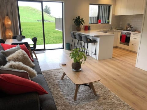 Your home away from home... enjoy a cup of tea or glass of wine while the kids play outside .. 
check out the stars at night.. with no light pollution and just the moreporks to lull you to sleep!
