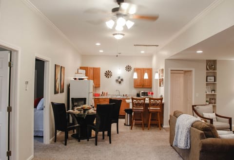 Spacious kitchen, table, and cozy living room. 