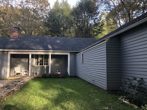 Private parking lot adjacent to single story house.  Stairs to w/d in basement.