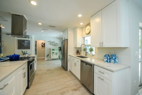kitchen fully loaded with every conceivable small appliance
