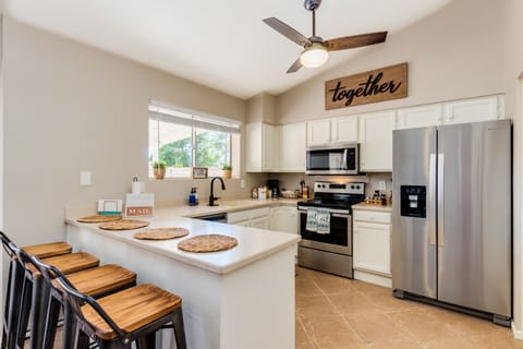 Fully stocked kitchen with brand new appliances and multiple seating areas