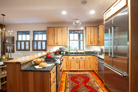 Chef's kitchen with gas range and dishwasher.