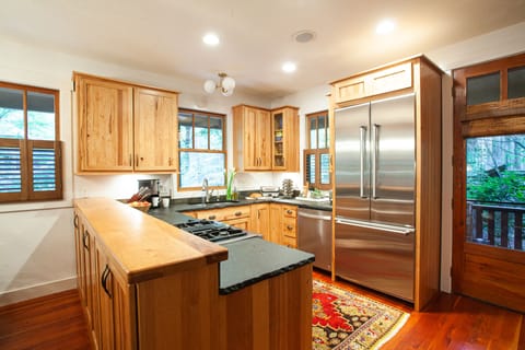 Chef's kitchen with gas range and dishwasher.