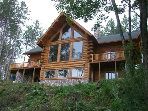 Authentic, spacious log cabin nestled on the Pine River. Sleeps up to 28.