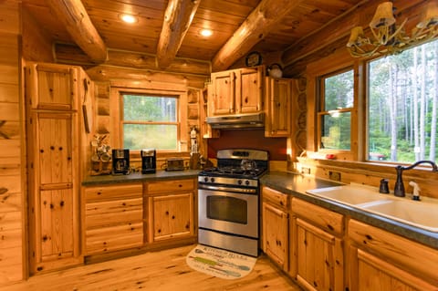 Kitchen has double coffee makers, gas range, and pantry stocked with essentials.