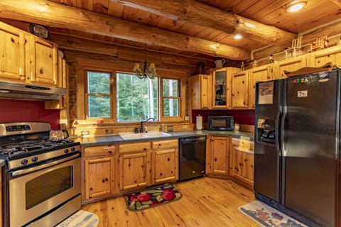 Spacious & fully loaded kitchen overstocked with pots, pans, and cast iron. 