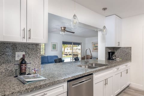 Enjoy the open-concept ambiance of this house and incredible views of Bahama Canal.Modern kitchen has granite counters, gas range, stainless steel appliances, dishwasher,minimalist glass-pendant chandelier lighting.
