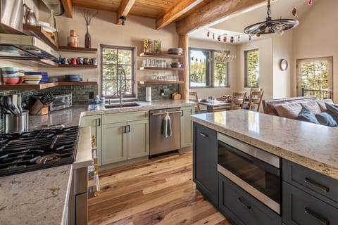 Your spacious kitchen features granite counters, stainless appliances, and rustic beams - perfect for cooking memorable meals.