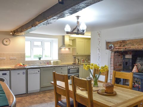 Fantastic kitchen/diner with beams and feature fireplace | Upper Ffinnant - Ffinnant, Soar, near Brecon