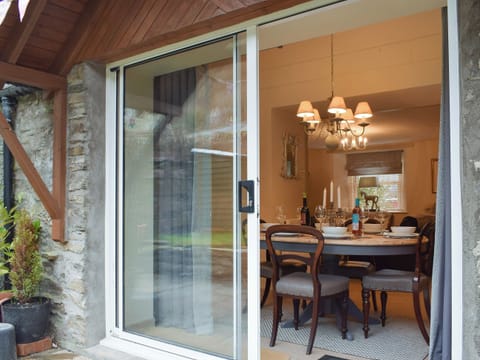 Patio door to dining area | Smiddy Cottage, Weem, near Aberfeldy