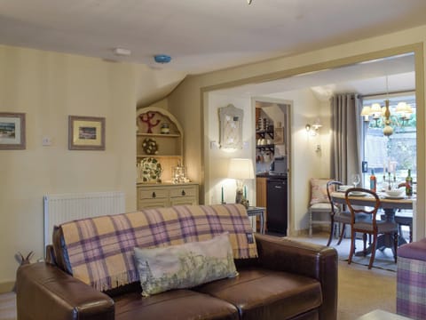 Spacious living room with open aspect to dining room | Smiddy Cottage, Weem, near Aberfeldy