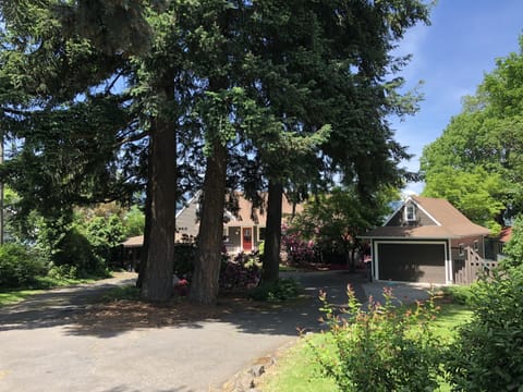 Front-of-house circle driveway with covered parking. Yard space for play!