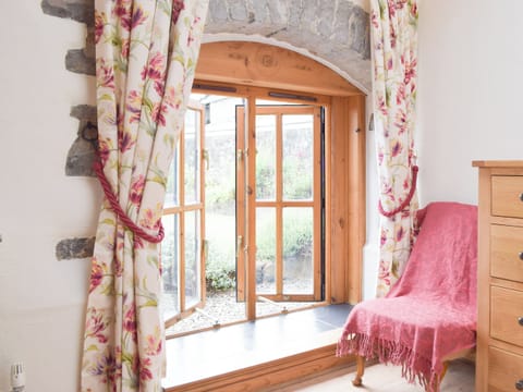 Pretty bedroom with delightful furnishings | The Byre - Lyserry Barns, Bosherston, near Pembroke