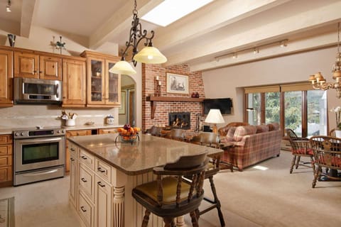 The newly remodeled kitchen flows into the warm and inviting dining and living areas of this comfortable vacation rental.