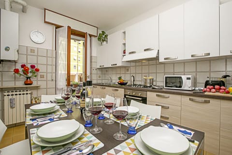 The seperated kitchen with dining table