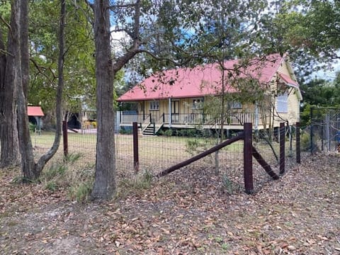 The 'Old Schoolhouse' with tennis court on the right side.
