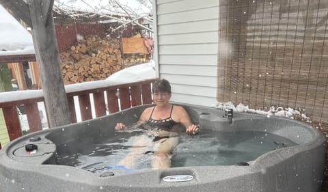 2 person hot tub on shared back deck helps relax those sore muscles.