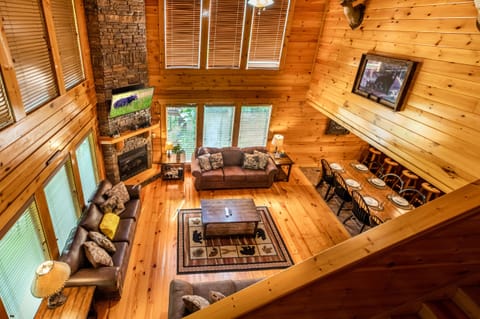 View from lofted game room into open living area with 20-ft. ceiling.